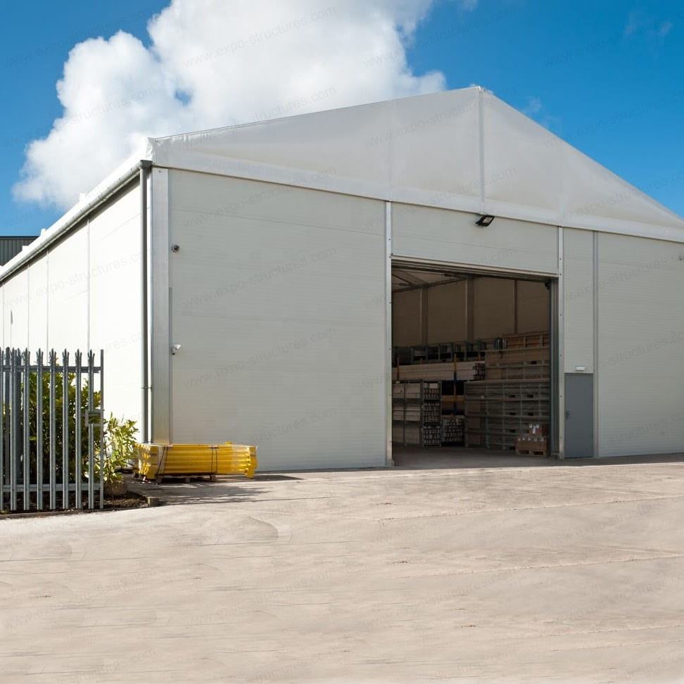बड़े औद्योगिक गोदाम भंडारण तम्बू यूवी-प्रूफ पीवीसी वाटरप्रूफ फायरप्रूफ सैंडविच टिकाऊ स्टील शीट फैब्रिक आउटडोर उपयोग लोगो