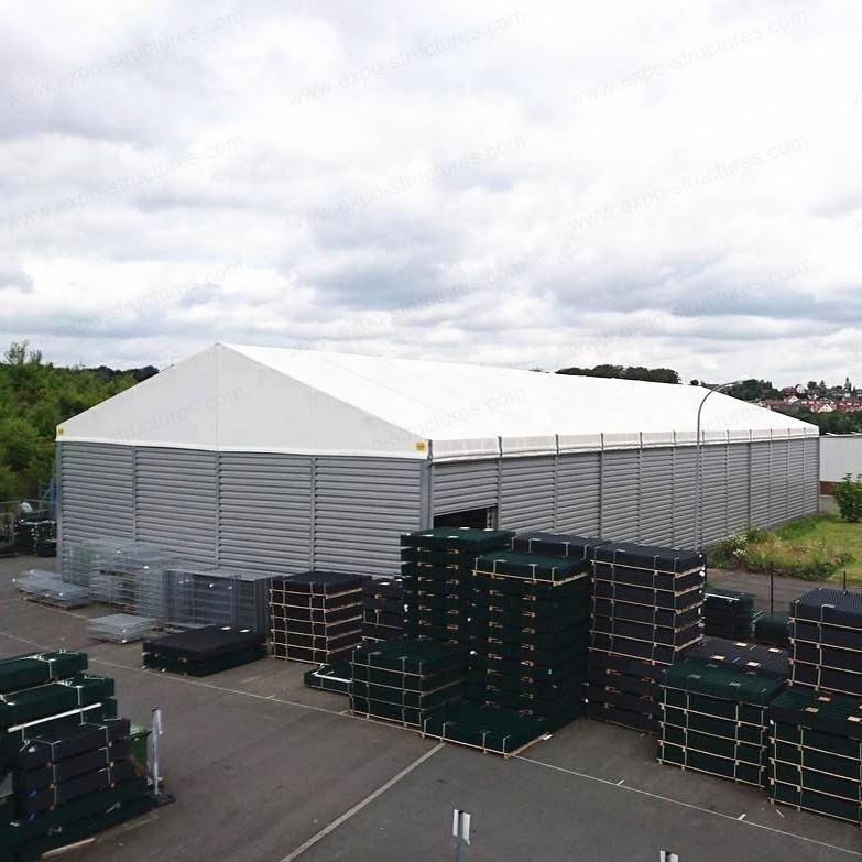 बड़े औद्योगिक गोदाम भंडारण तम्बू यूवी-प्रूफ पीवीसी वाटरप्रूफ फायरप्रूफ सैंडविच टिकाऊ स्टील शीट फैब्रिक आउटडोर उपयोग लोगो